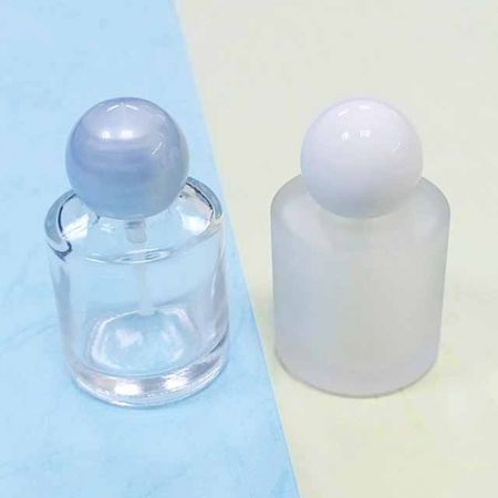 Empty glass bottle and round plastic cap